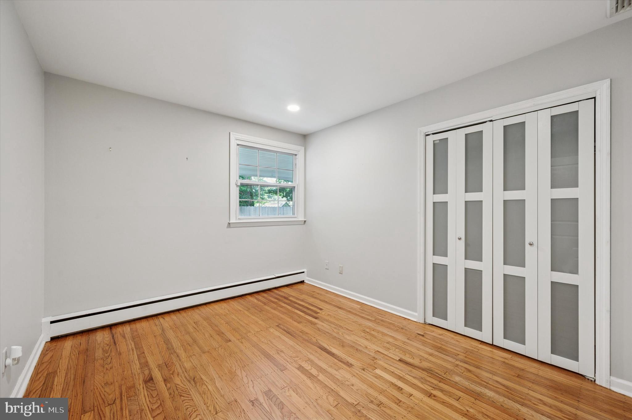 300 West Rose Tree Road Media, PA 19063 - Photo 8 of 16 a view of empty room with wooden floor and fan