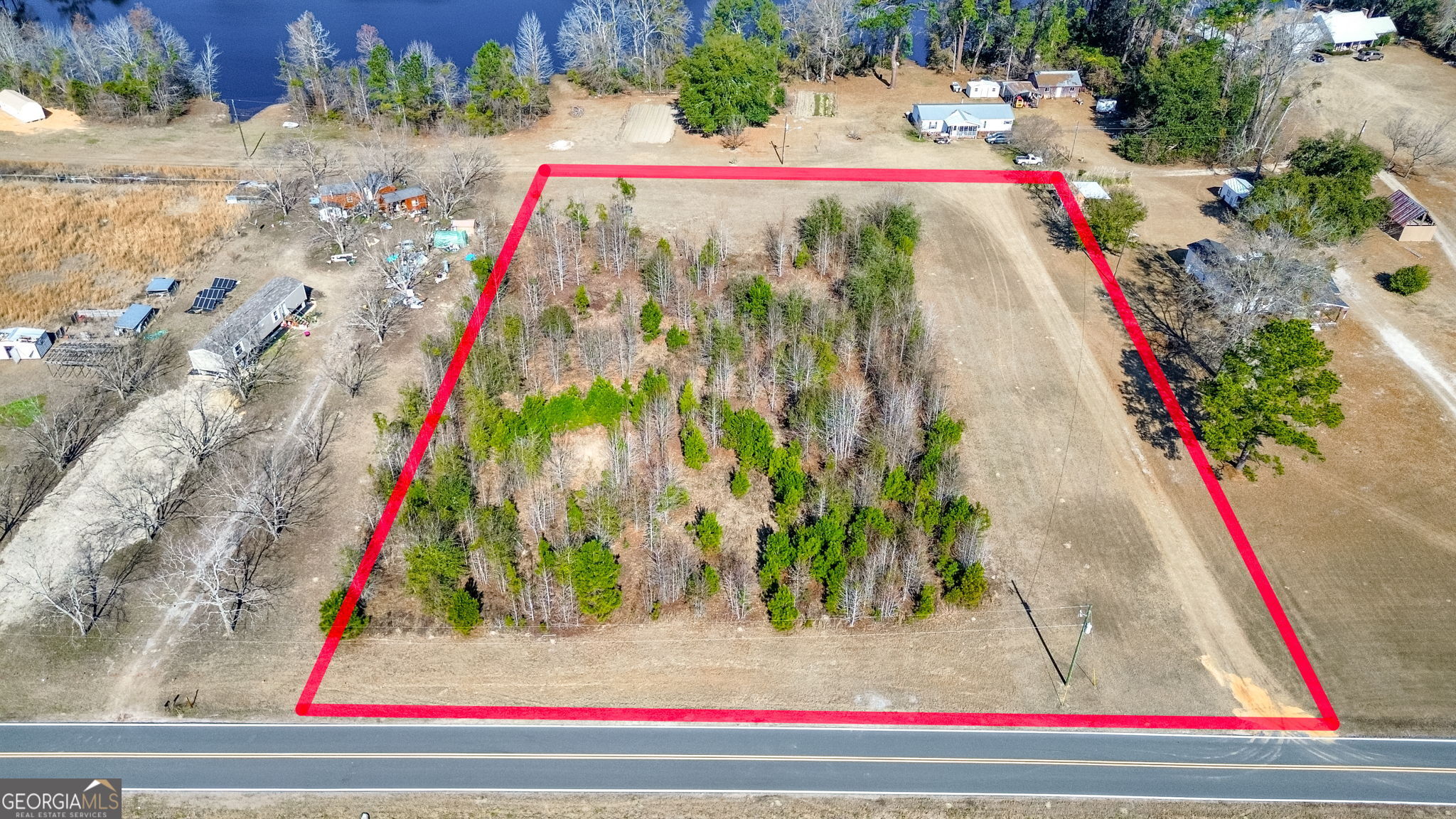 a view of swimming pool with red umbrella