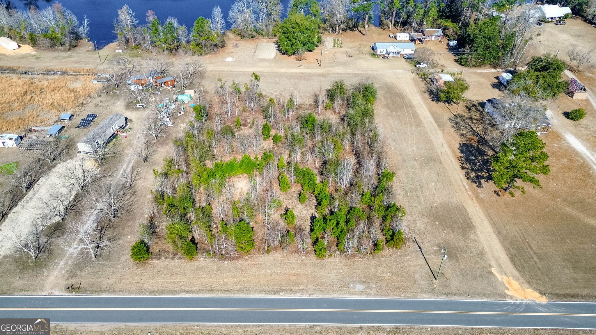 0 Clark Road Guyton, GA 31312 - Photo 2 of 12 a view of a yard with street