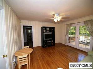 4311 Castlewood Road Charlotte, NC 28209 - Photo 7 of 8 a view of a livingroom with furniture and a large window