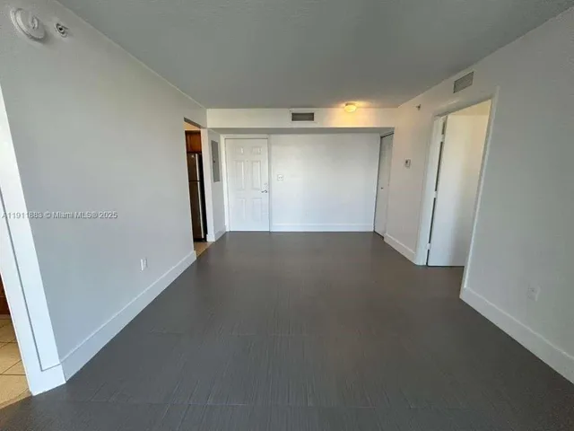 an empty room with a natural light