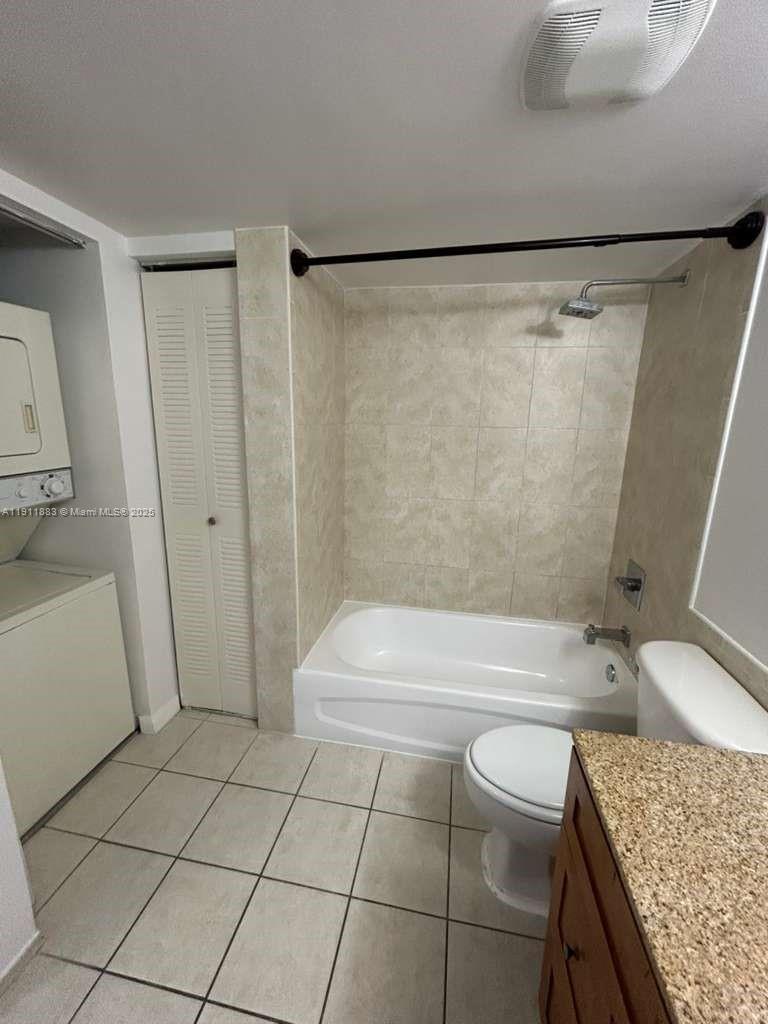 219 Northwest 12th Avenue, Unit 1002 Miami, FL 33128 - Photo 8 of 15 a bathroom with a granite countertop bathtub shower sink and toilet