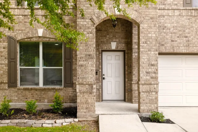 a brick building with a door and a window