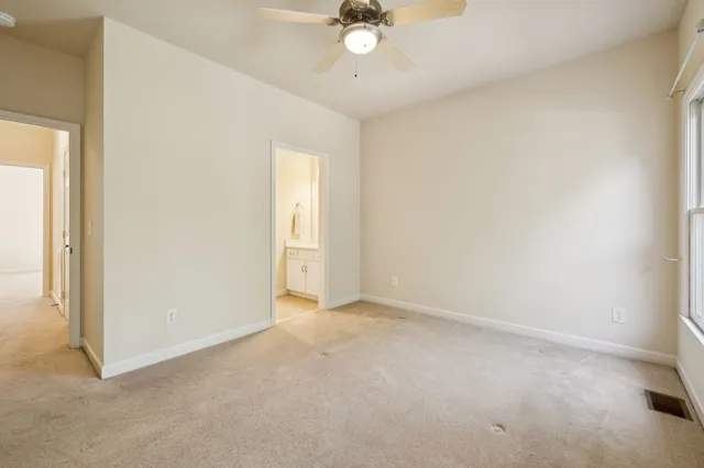 a big house with a big yard and large trees