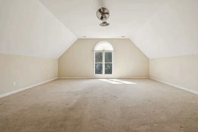 an aerial view of a house with a swimming pool