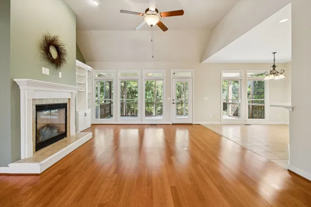 a view of a kitchen with wooden floor and a kitchen