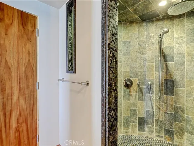 a bathroom with a bathtub and a shower