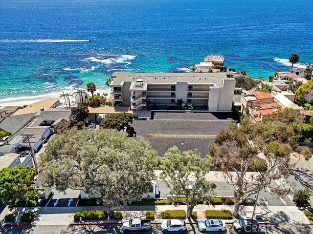 a view of a parking space with cars parked