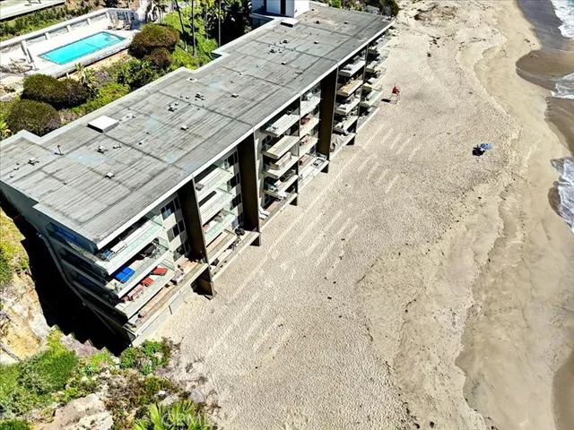 an aerial view of a house with outdoor space