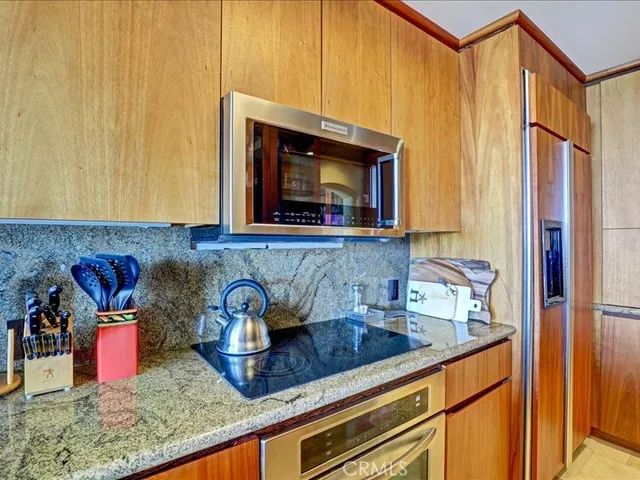 a bathroom with a tub a sink and a mirror