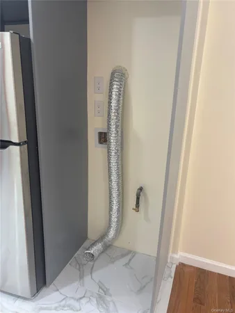 a bathroom with a granite countertop shower and a sink