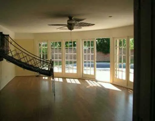 a view of an entryway with wooden floor