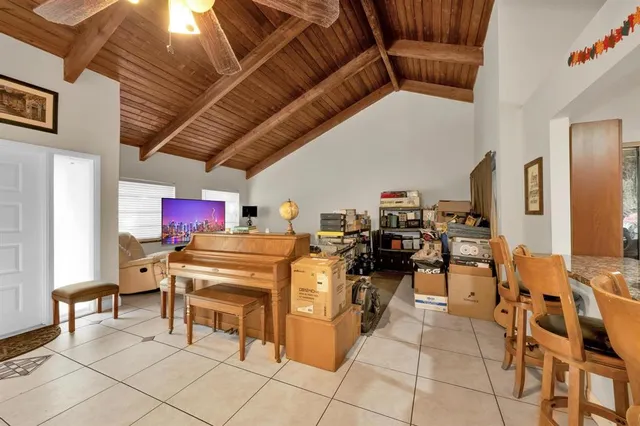 a work place with chairs and white walls