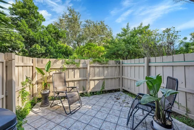 a view of a backyard with a patio
