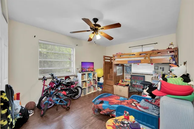 a play room with toys and a tv