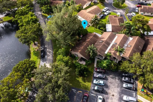 an aerial view of residential house with outdoor space and lake view