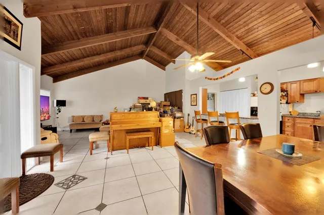 a room with lots of furniture and a chandelier