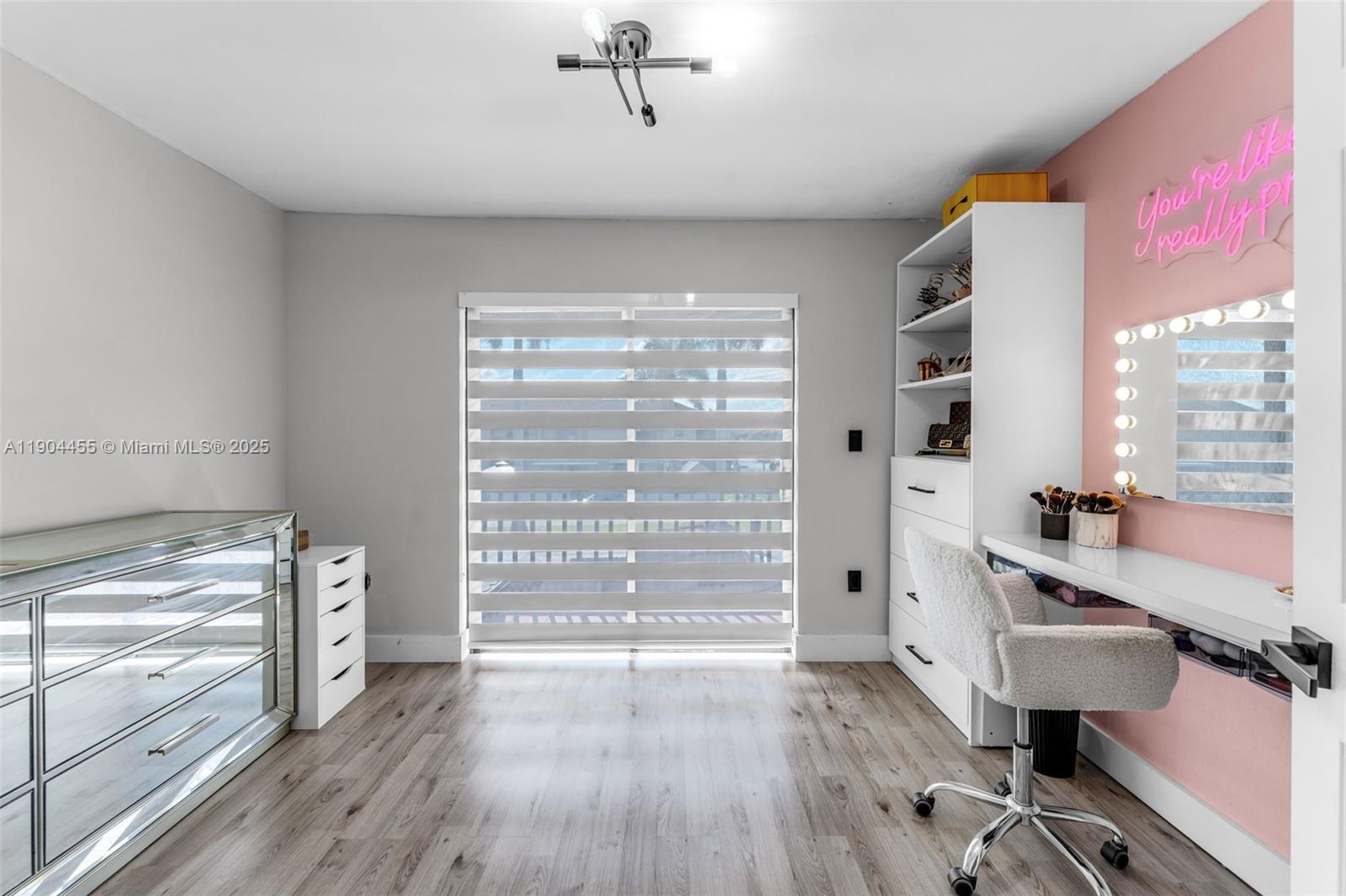 13350 Southwest 58th Terrace, Unit 38 Miami, FL 33183 - Photo 4 of 8 a view of a livingroom with furniture hardwood floor and a window