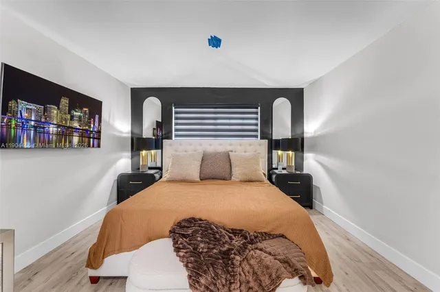 a bedroom with a large bed and a book shelf