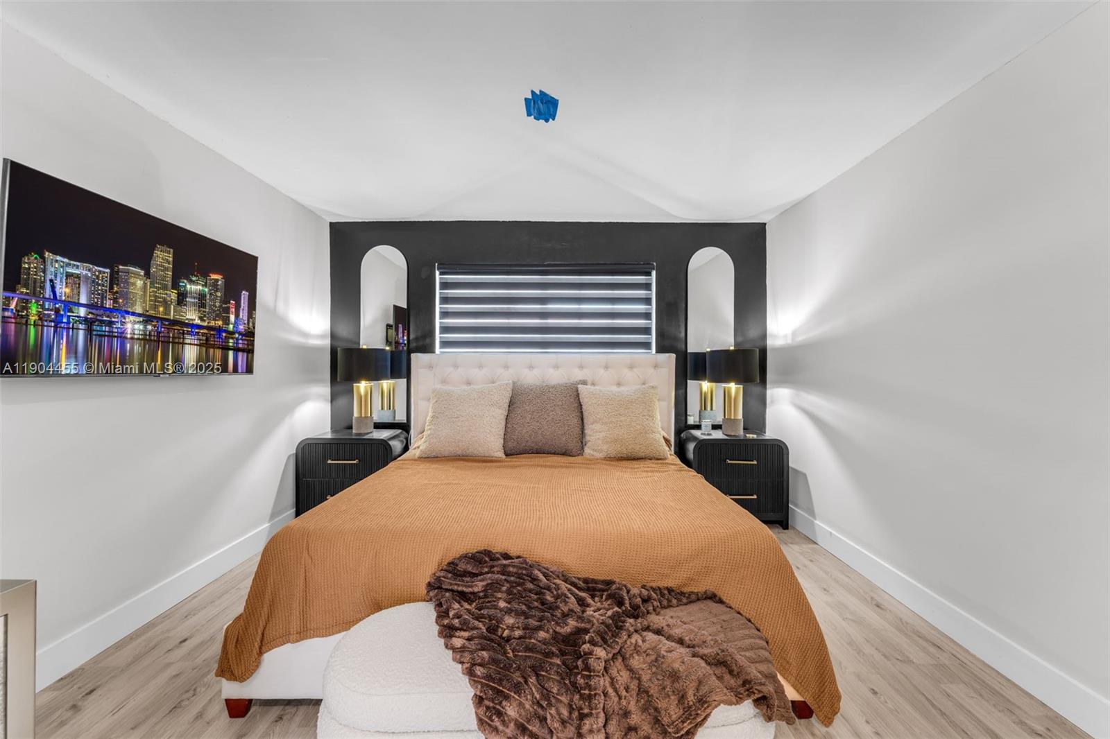 13350 Southwest 58th Terrace, Unit 38 Miami, FL 33183 - Photo 5 of 8 a bedroom with a large bed and a book shelf