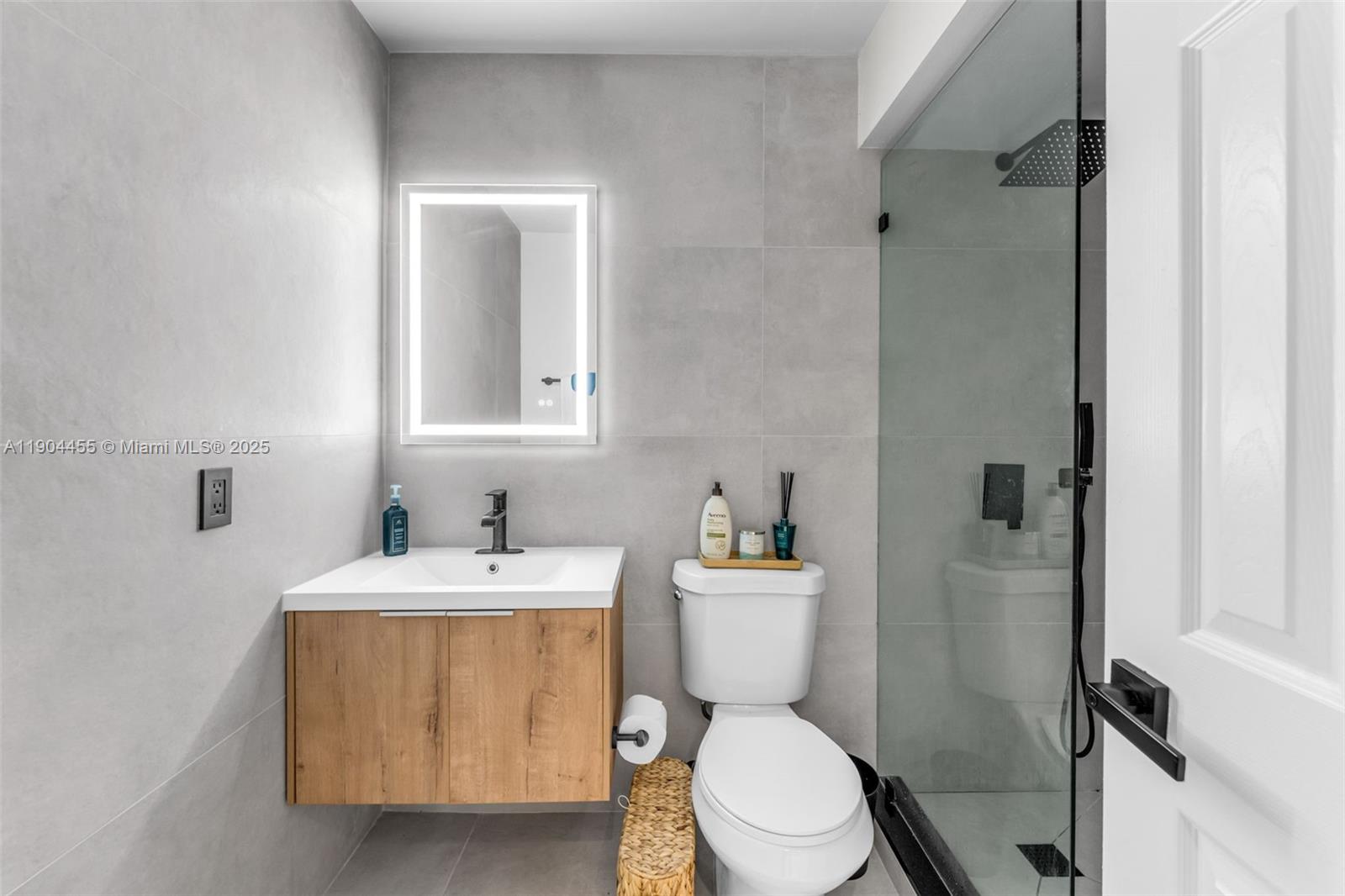 13350 Southwest 58th Terrace, Unit 38 Miami, FL 33183 - Photo 6 of 8 a bathroom with a sink toilet and shower