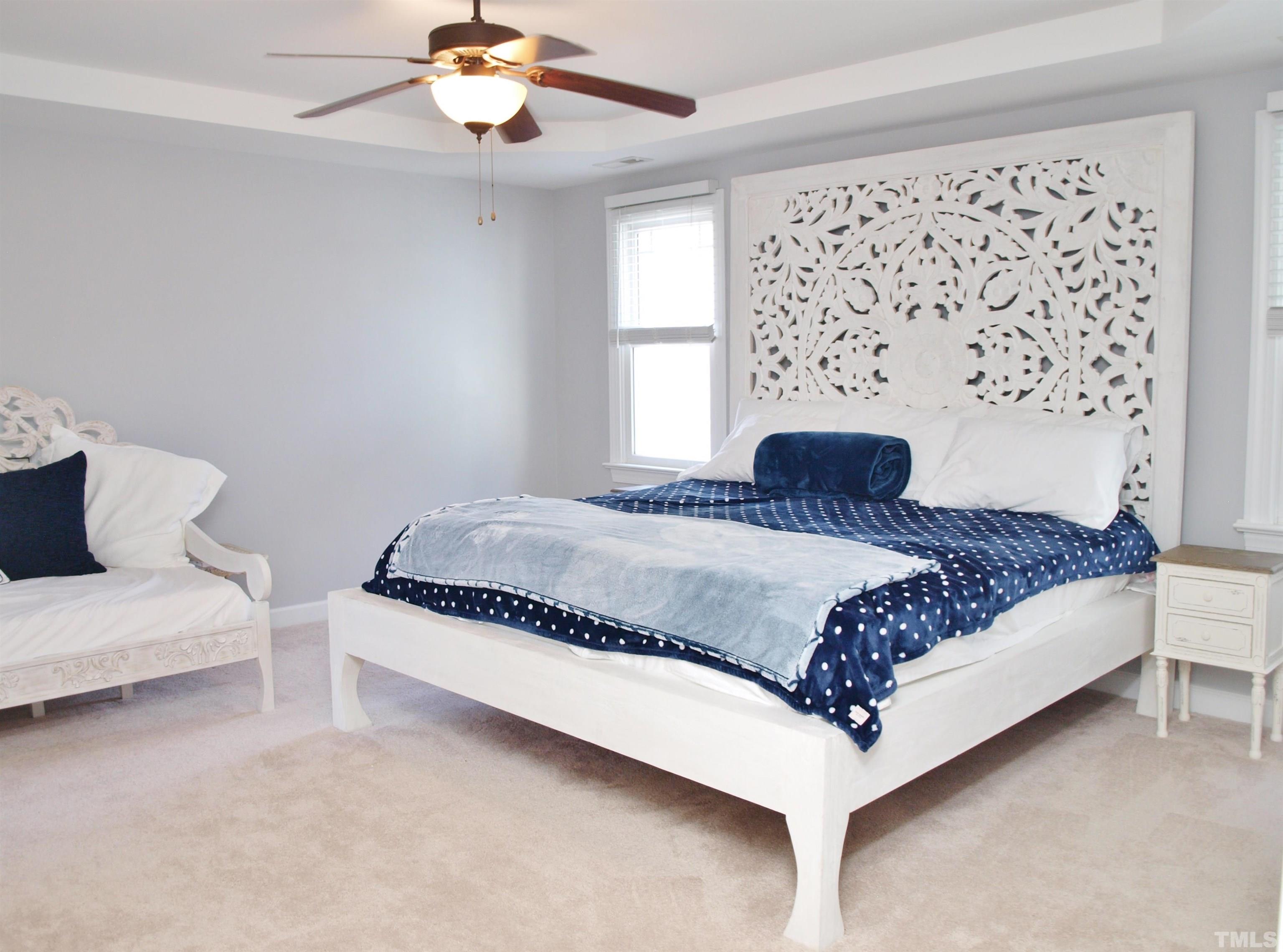 2223 Cloud Cover Lane Raleigh, NC 27614 - Photo 11 of 26 a bedroom with a large bed and a window