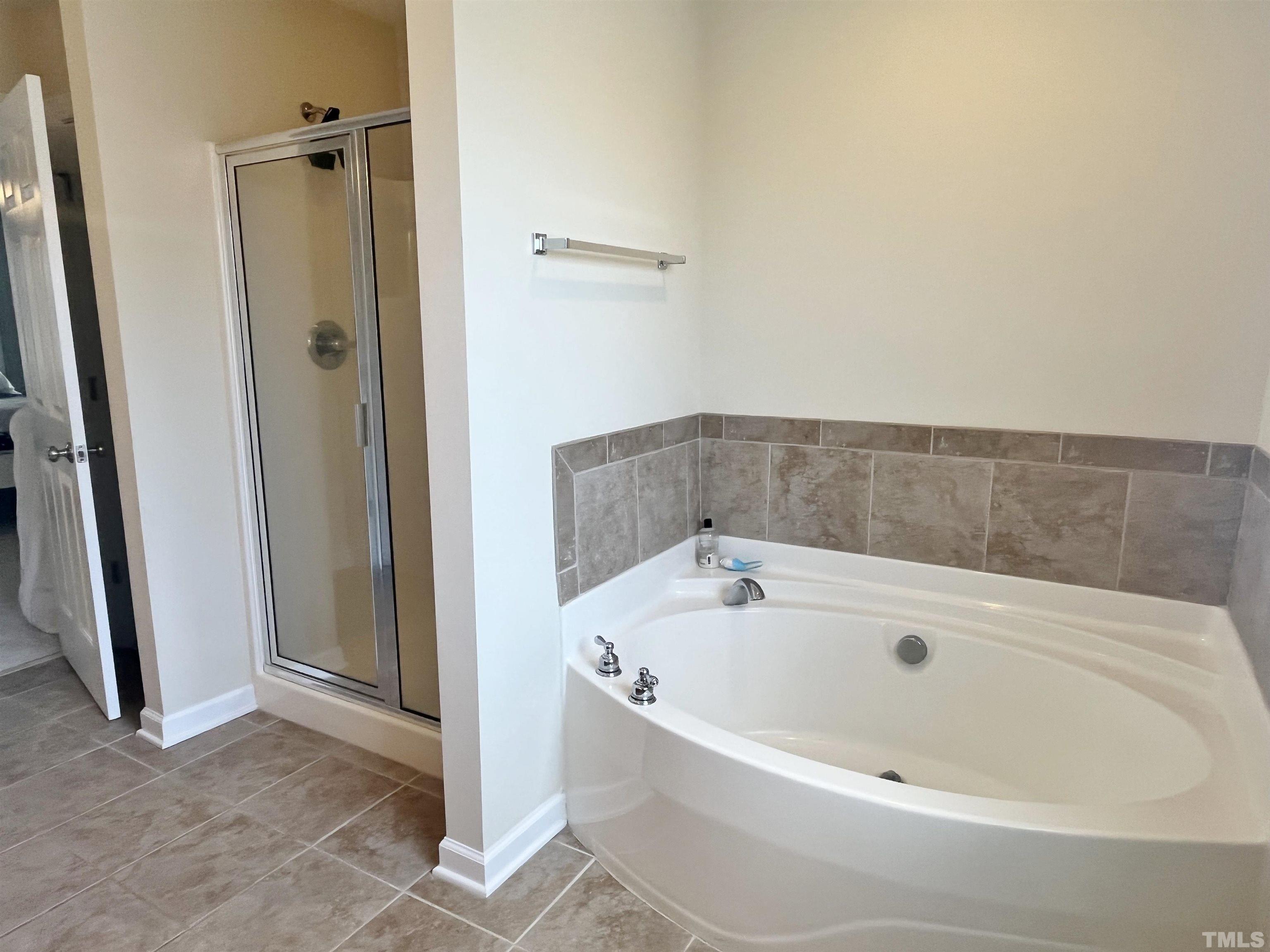 2223 Cloud Cover Lane Raleigh, NC 27614 - Photo 13 of 26 a bathroom with a tub and shower