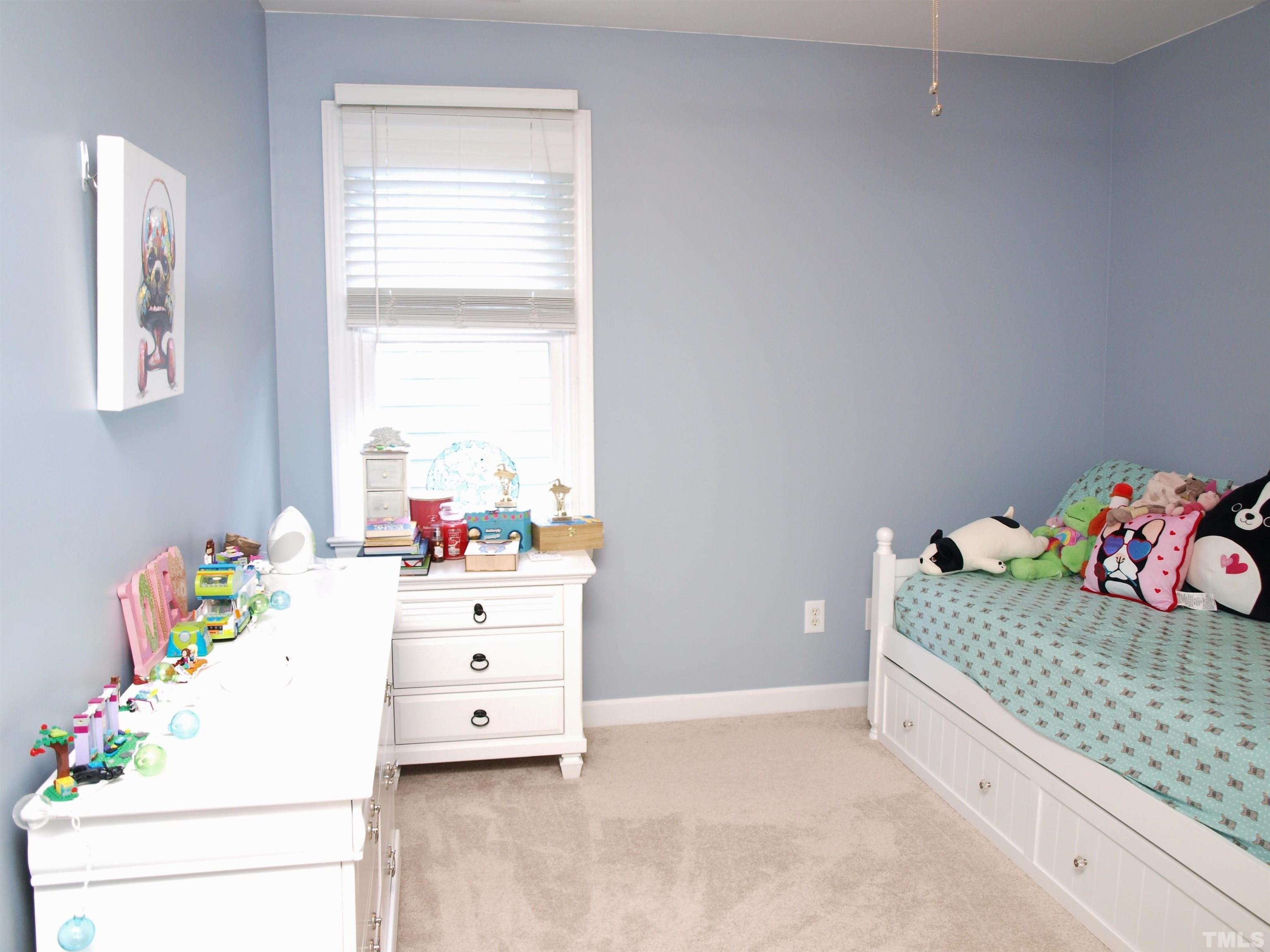 2223 Cloud Cover Lane Raleigh, NC 27614 - Photo 16 of 26 a kitchen with a cabinets and bed