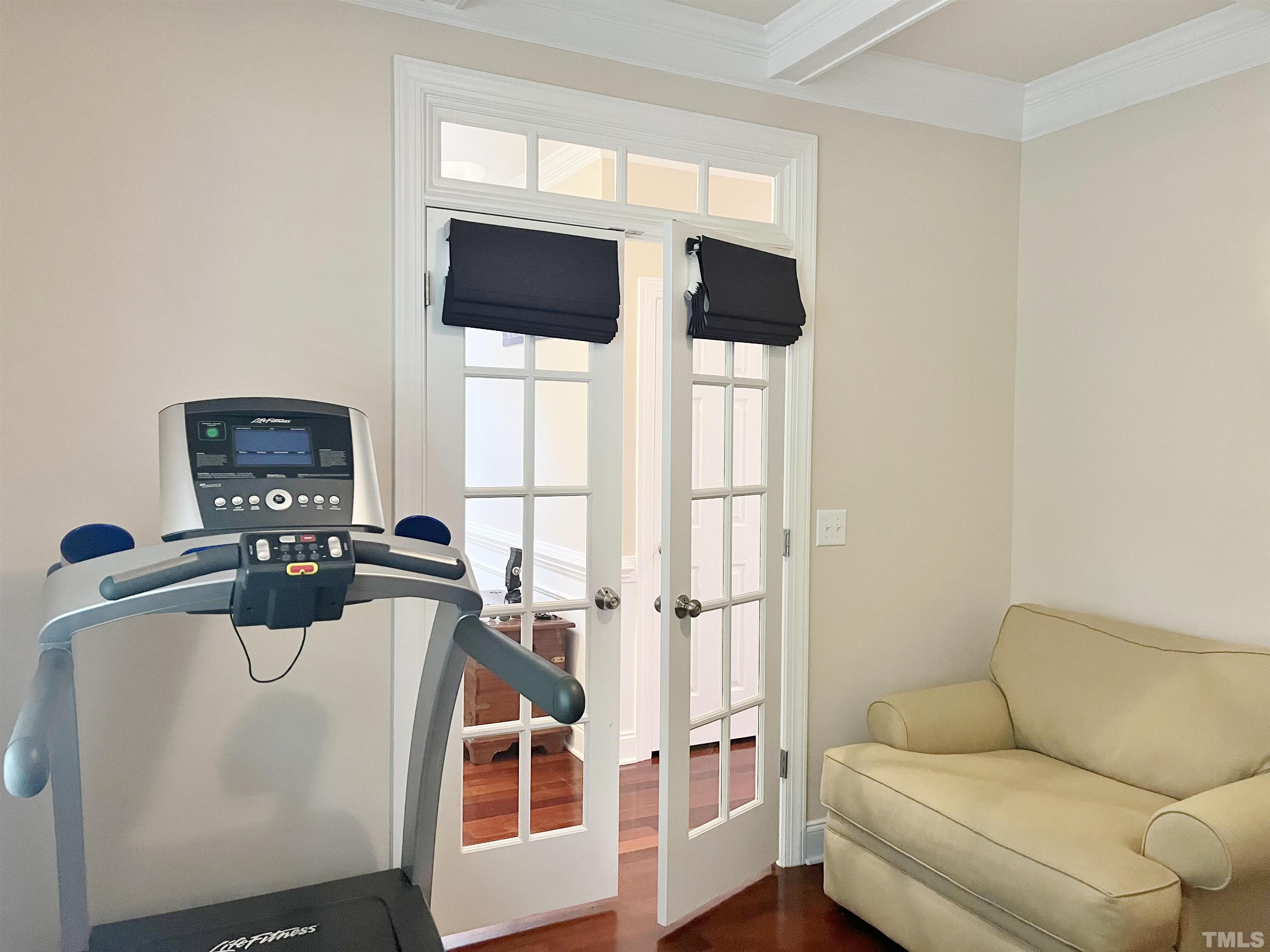 2223 Cloud Cover Lane Raleigh, NC 27614 - Photo 19 of 26 a living room with furniture a flat screen tv and a window