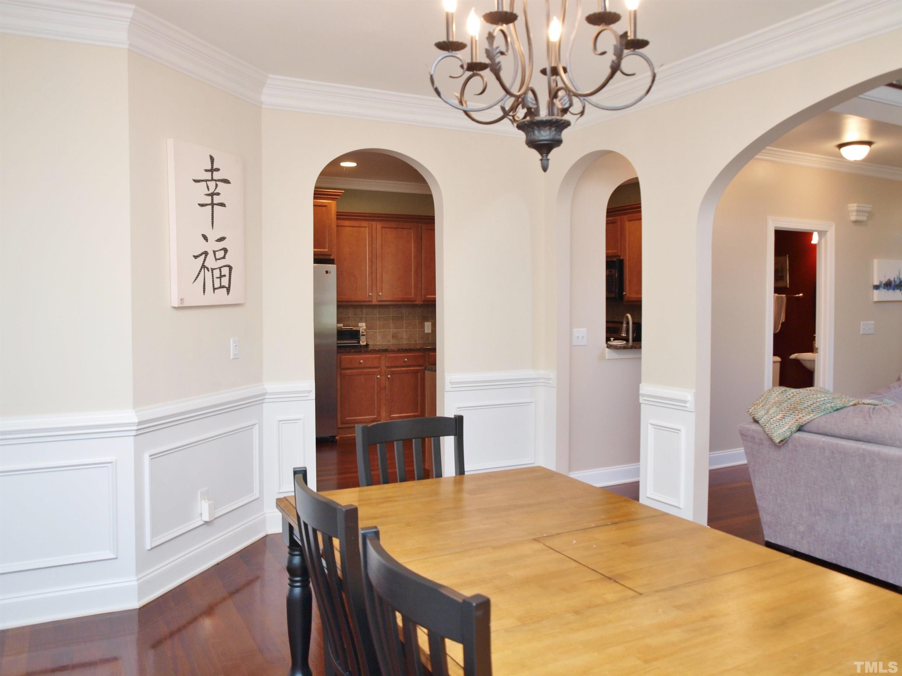 2223 Cloud Cover Lane Raleigh, NC 27614 - Photo 4 of 26 a bedroom with a bed and a chandelier