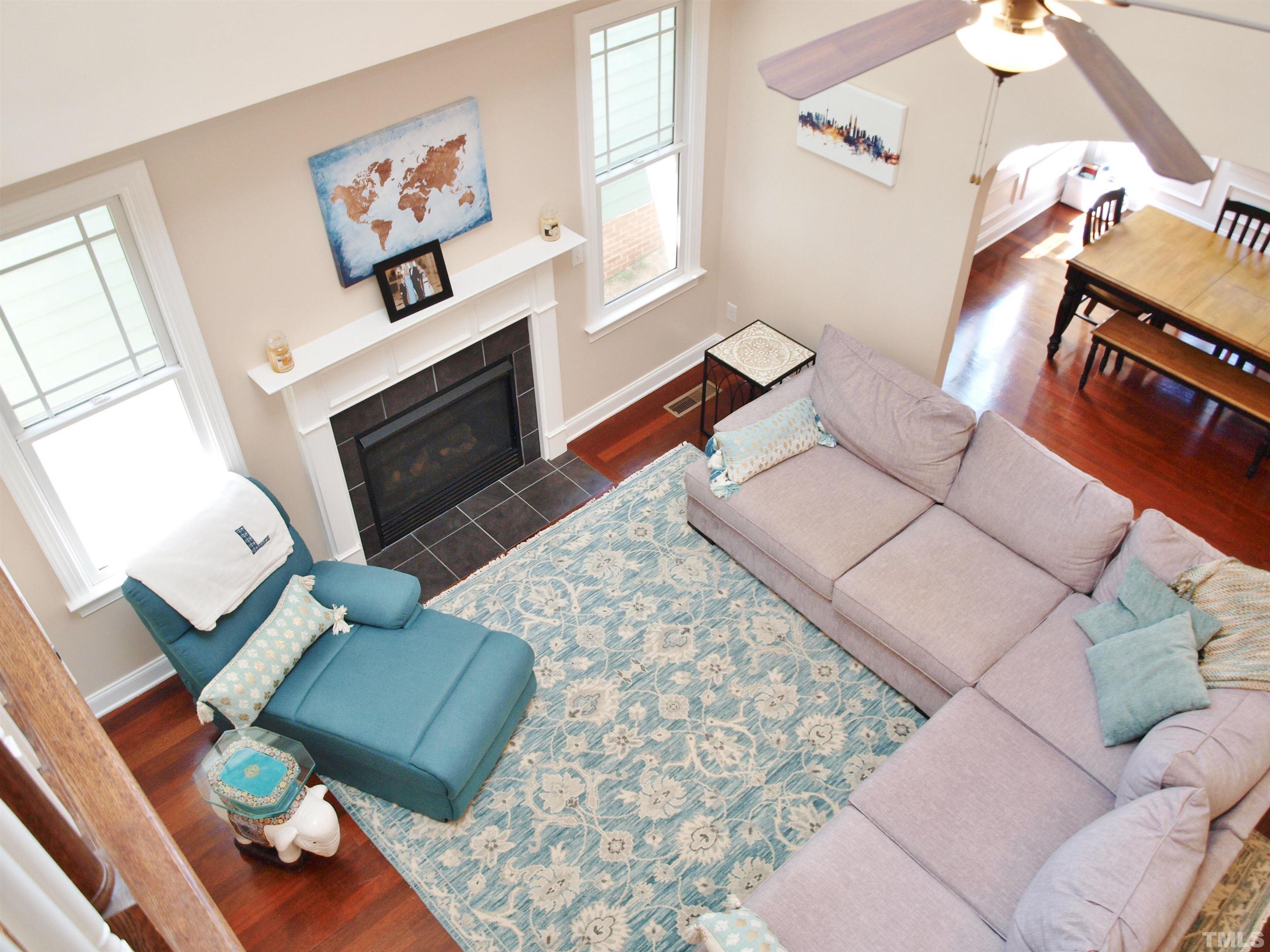 2223 Cloud Cover Lane Raleigh, NC 27614 - Photo 5 of 26 a living room with furniture and a fireplace