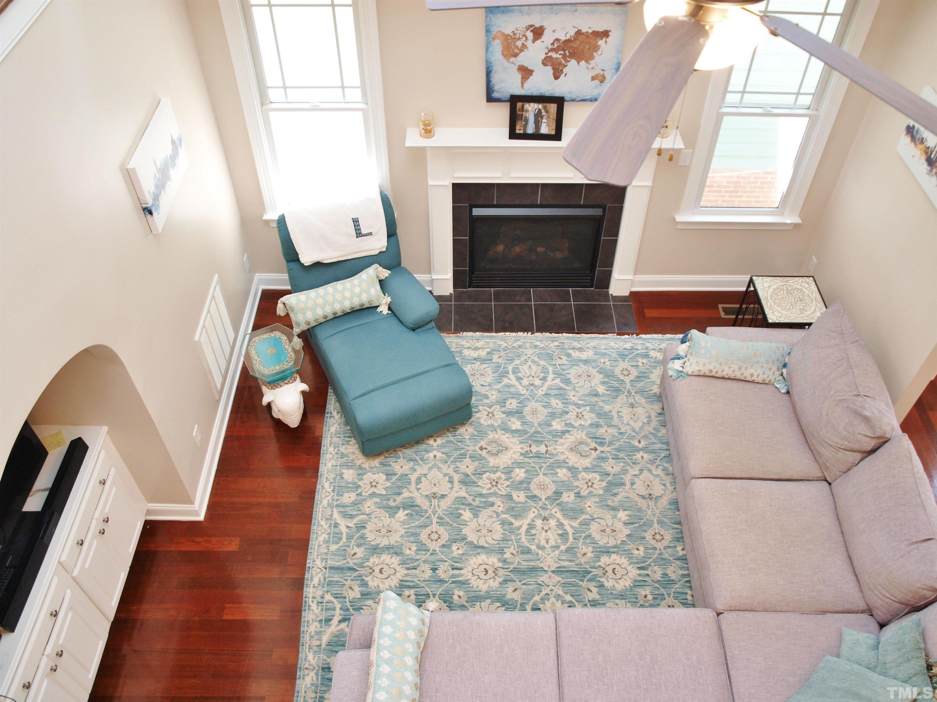 2223 Cloud Cover Lane Raleigh, NC 27614 - Photo 6 of 26 a living room with furniture and a fireplace