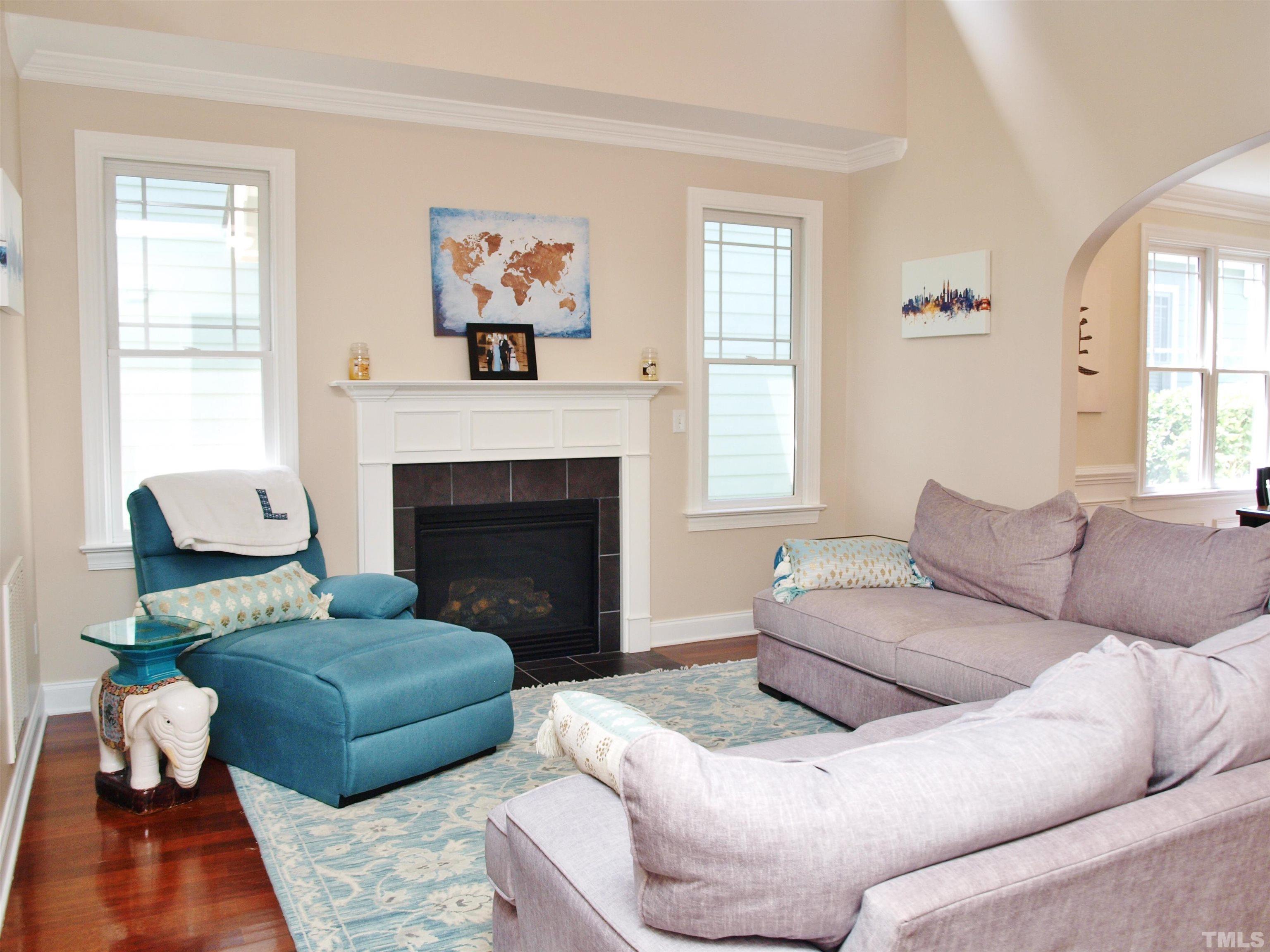 2223 Cloud Cover Lane Raleigh, NC 27614 - Photo 7 of 26 a living room with furniture and a fireplace