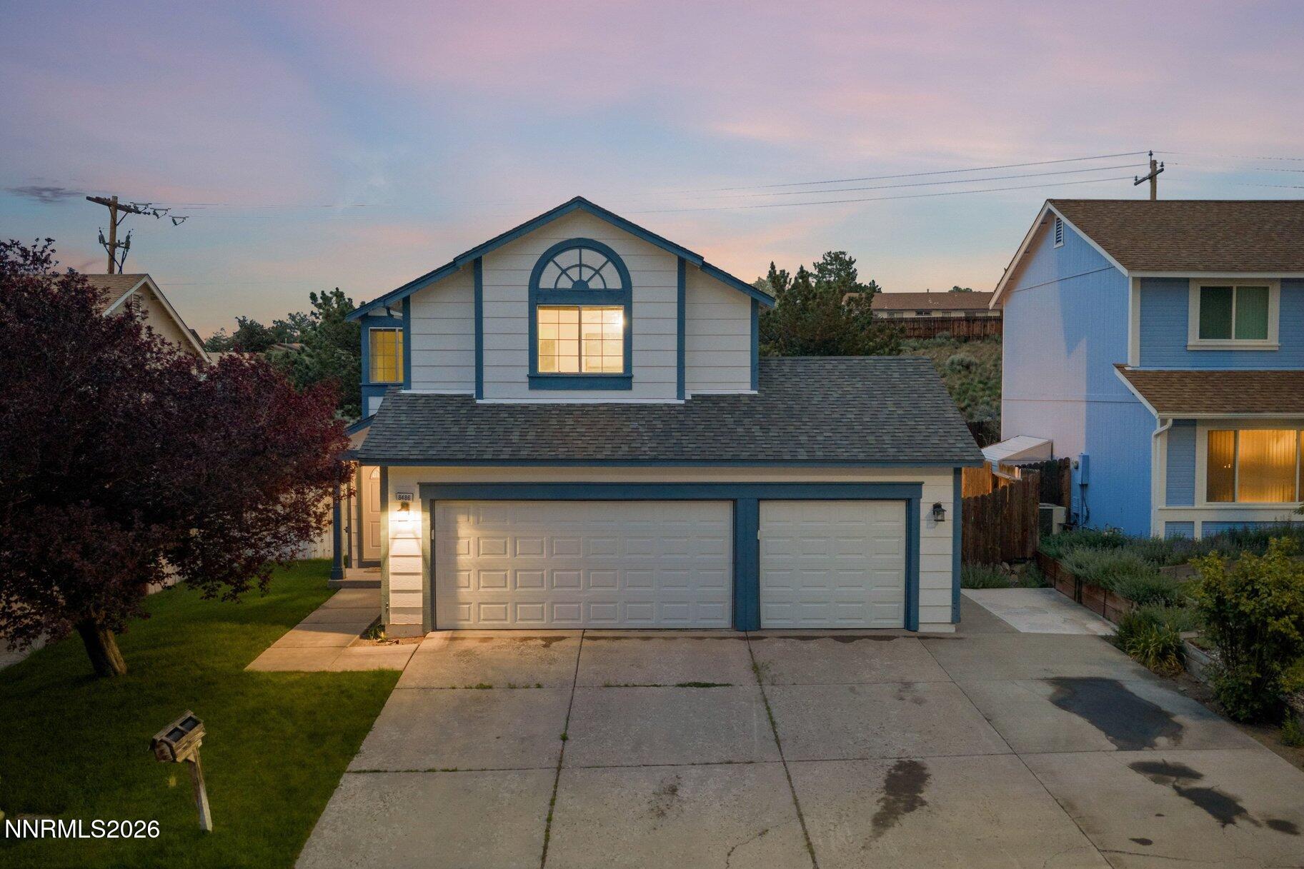 8486 Piper Place Reno, NV 89506 - Photo 77 of 80 a front view of a house with garden