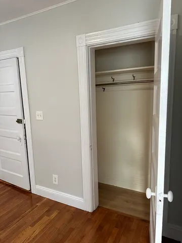 an empty room with wooden floor