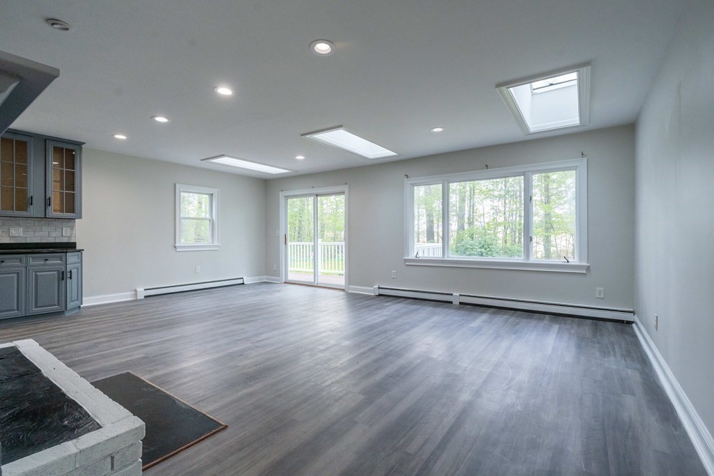 81 Onset Avenue Wareham, MA 02532 - Photo 14 of 42 an empty room with wooden floor and windows