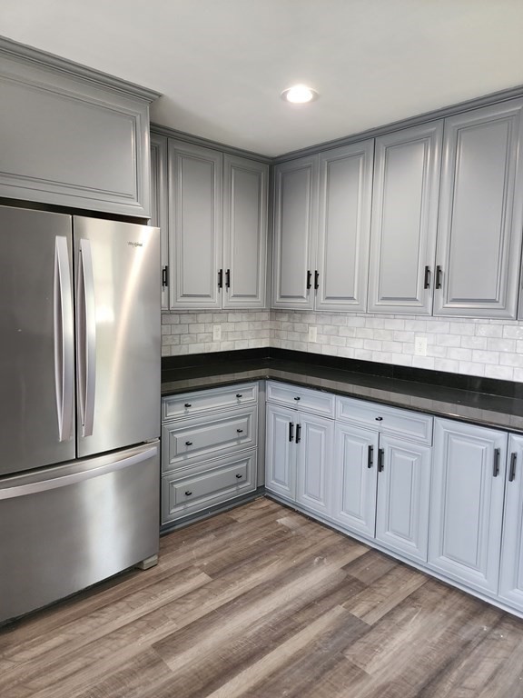 81 Onset Avenue Wareham, MA 02532 - Photo 24 of 42 a kitchen with granite countertop white cabinets and stainless steel appliances