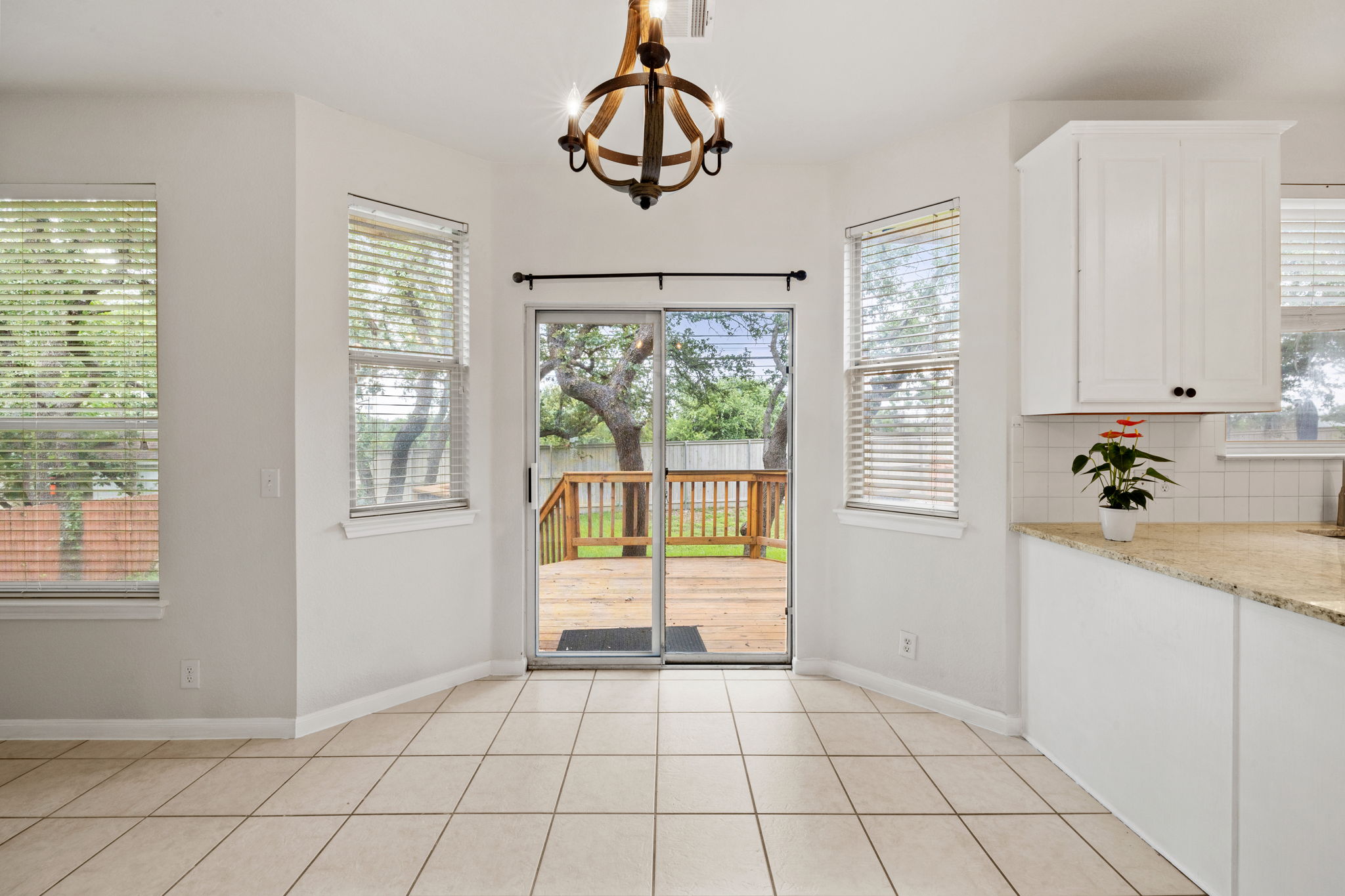 2732 Cascade Falls Drive Austin, TX 78738 - Photo 18 of 40 a view of an entryway and kitchen with windows