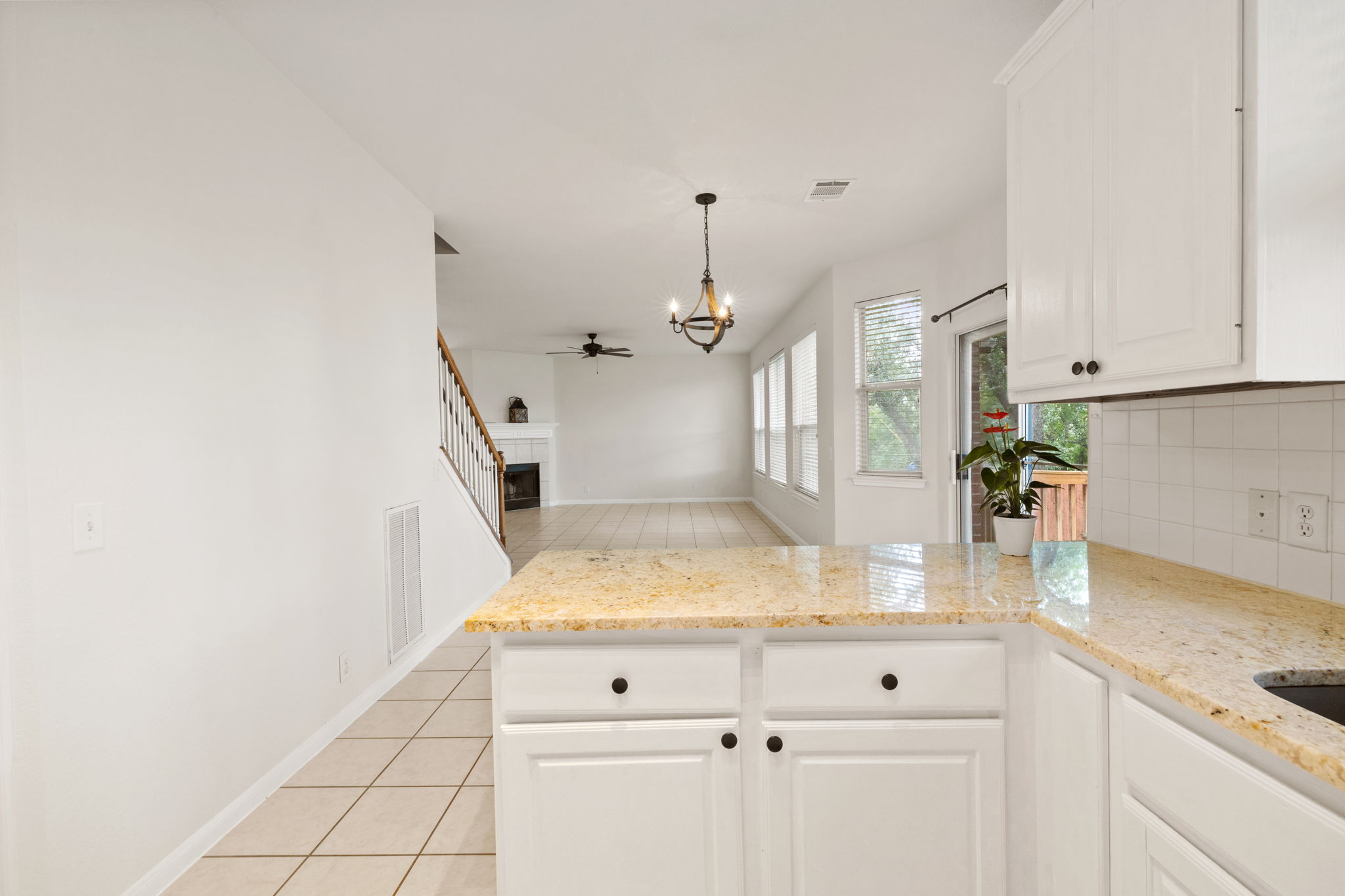 2732 Cascade Falls Drive Austin, TX 78738 - Photo 20 of 40 a view of kitchen with granite countertop white cabinets and sink