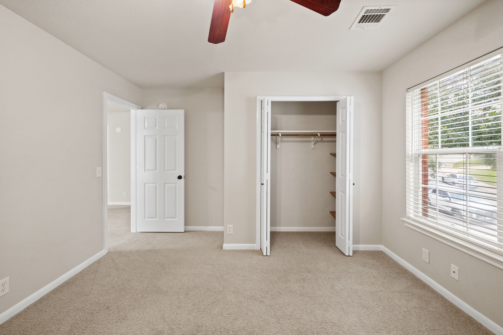2732 Cascade Falls Drive Austin, TX 78738 - Photo 26 of 40 an empty room with windows and closet