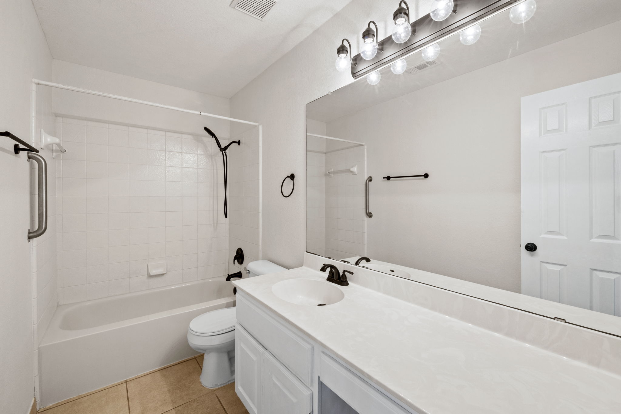 2732 Cascade Falls Drive Austin, TX 78738 - Photo 28 of 40 a bathroom with a sink a toilet a mirror and shower