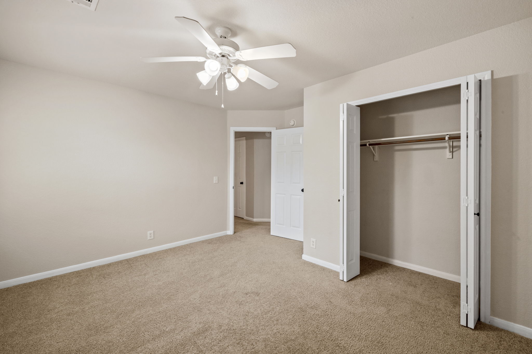2732 Cascade Falls Drive Austin, TX 78738 - Photo 31 of 40 a view of an empty room with a chandelier fan