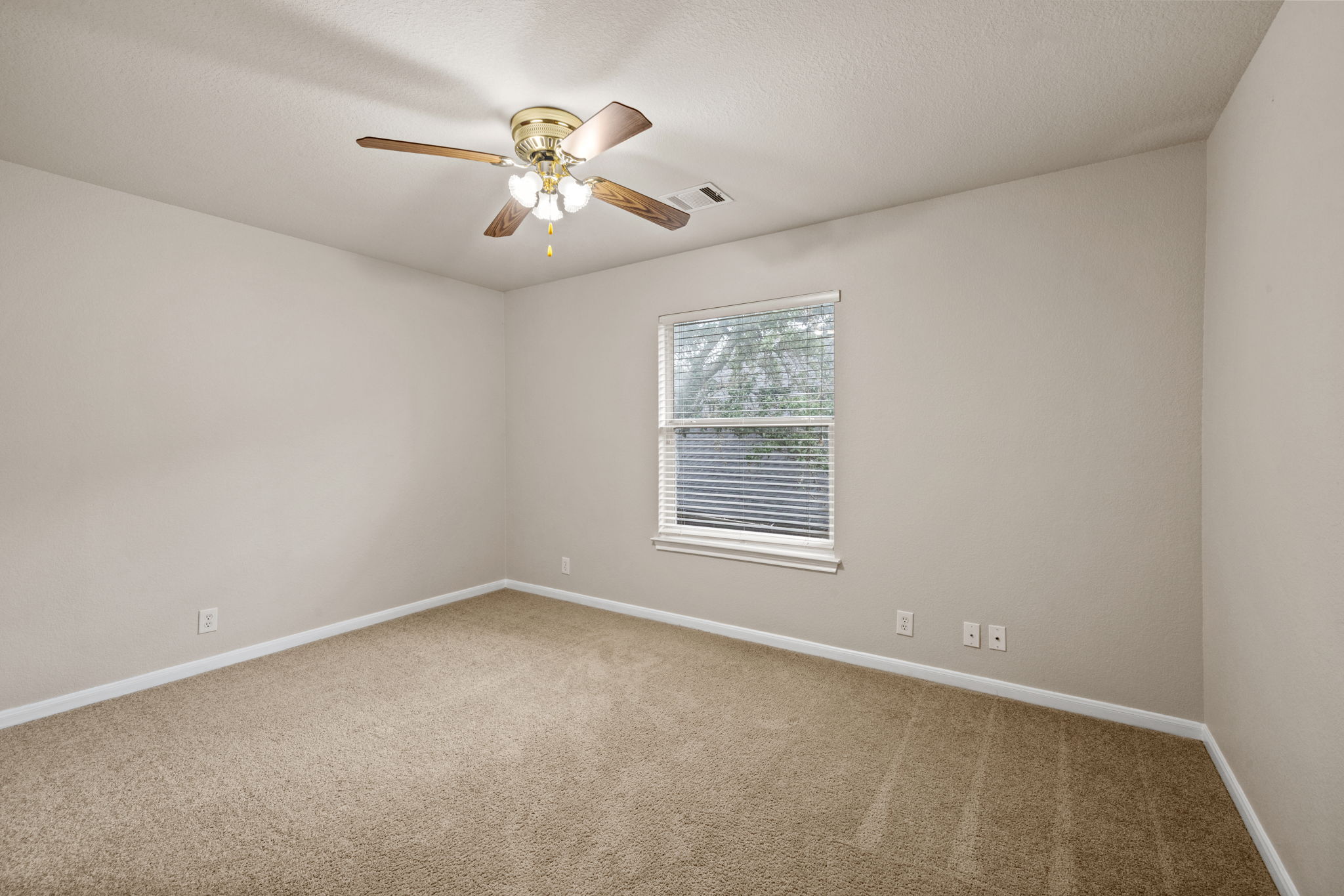2732 Cascade Falls Drive Austin, TX 78738 - Photo 32 of 40 an empty room with chandelier fan and windows