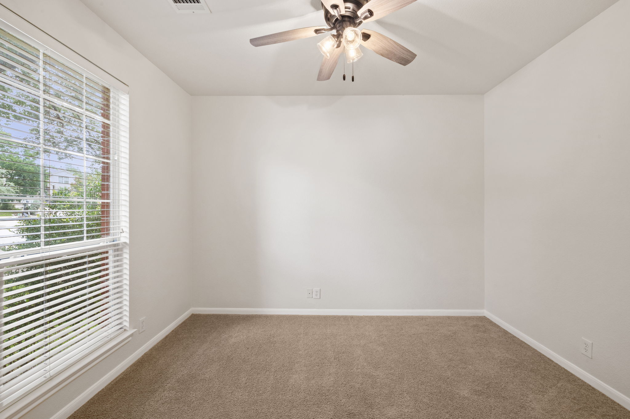 2732 Cascade Falls Drive Austin, TX 78738 - Photo 5 of 40 an empty room with a chandelier fan