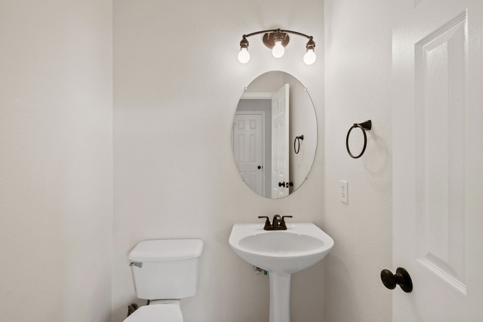2732 Cascade Falls Drive Austin, TX 78738 - Photo 8 of 40 a bathroom with a toilet sink and mirror