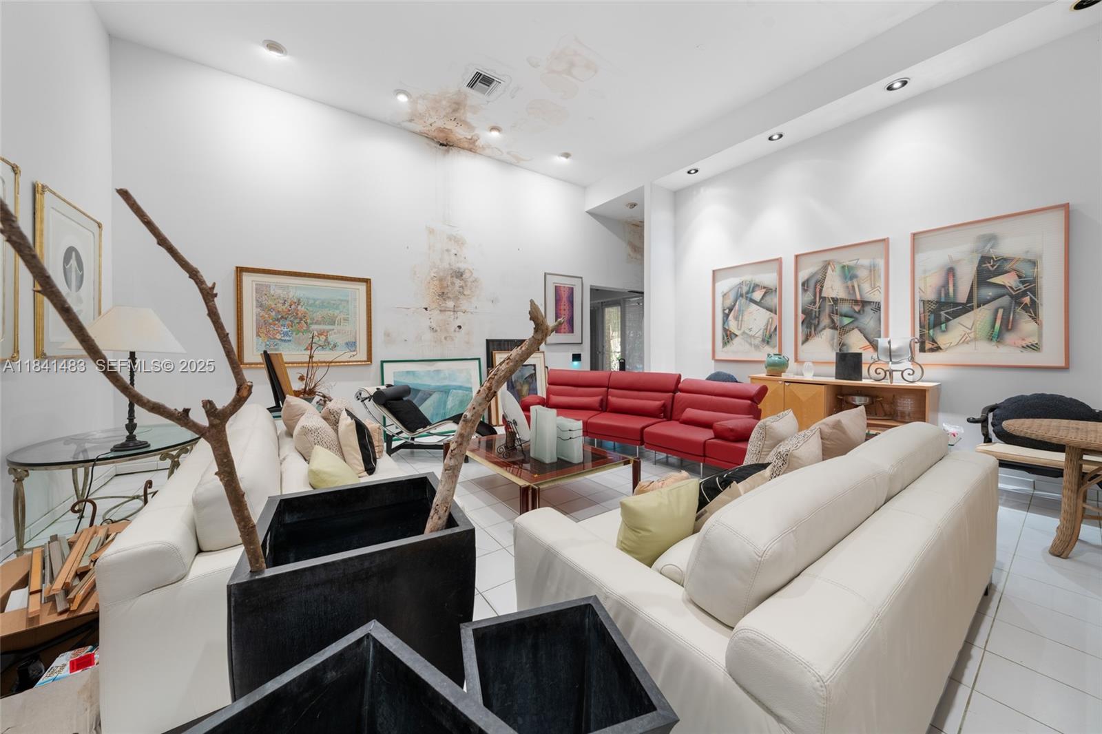 6002 Southwest 79th Court Miami, FL 33143 - Photo 13 of 47 a living room with furniture kitchen view and a wooden floor