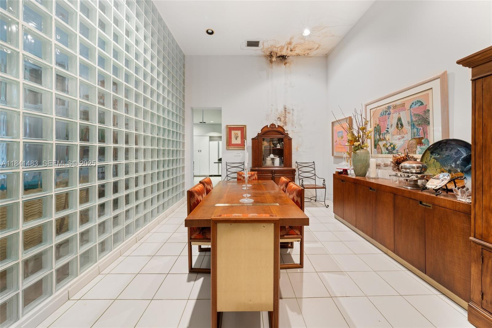 6002 Southwest 79th Court Miami, FL 33143 - Photo 15 of 47 a dining hall with a sink and a mirror