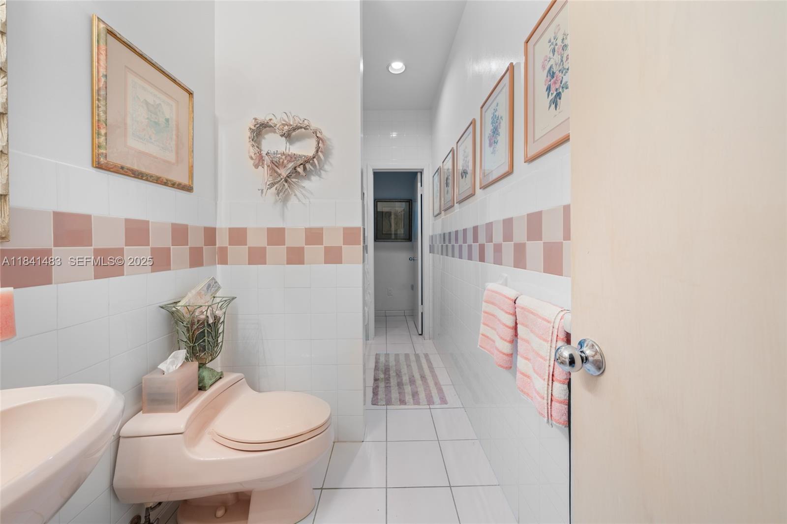 6002 Southwest 79th Court Miami, FL 33143 - Photo 23 of 47 a white toilet sitting next to a bathroom sink