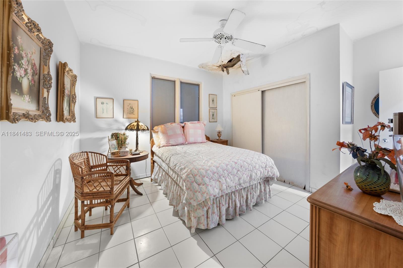 6002 Southwest 79th Court Miami, FL 33143 - Photo 26 of 47 a bedroom with a bed and a table in it