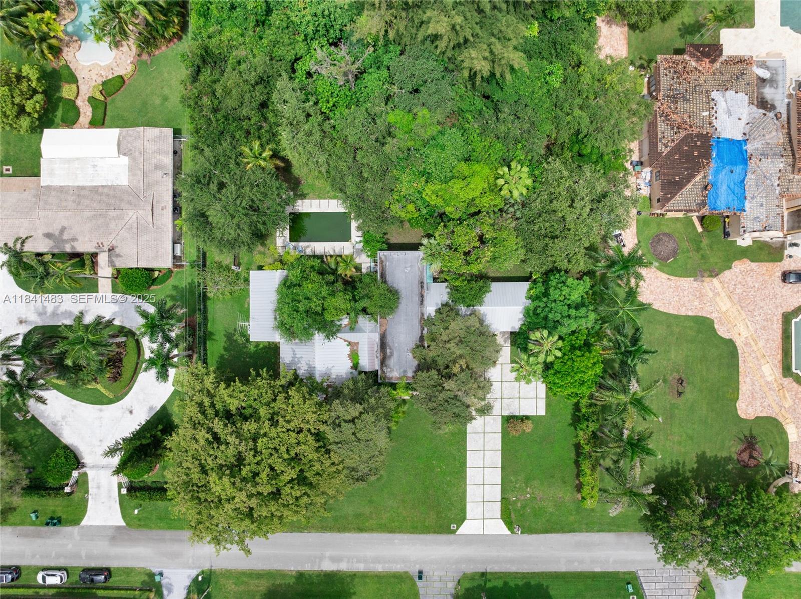 6002 Southwest 79th Court Miami, FL 33143 - Photo 3 of 47 an aerial view of a house with garden space and street view